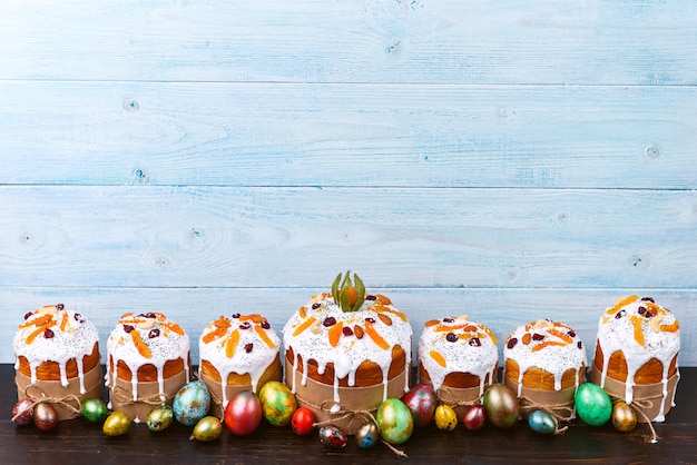 Classic Slavic Easter cakes with Easter eggs on a wooden table