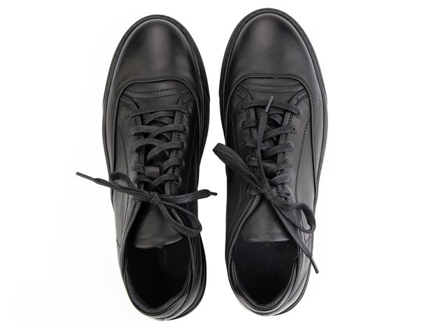 classic sneakers with laces casual style isolated closeup on white background top view fashion shoes