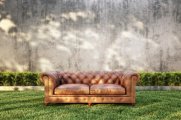 Classic Sofa with bush and bare concrete wall background. 