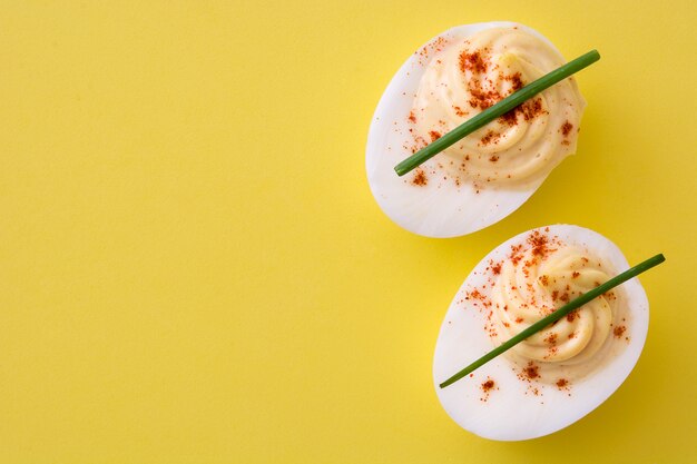 Photo classic stuffed egg isolated on yellow