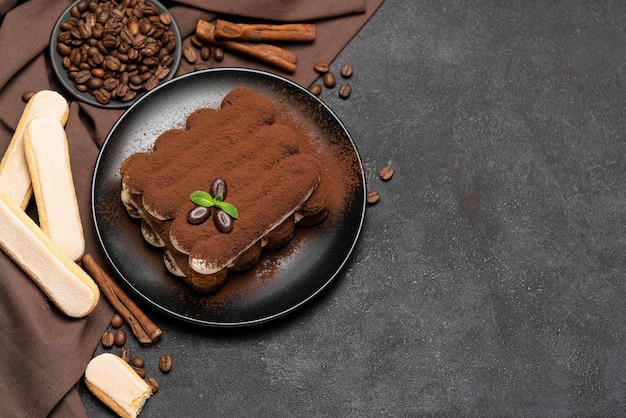 Classic tiramisu dessert on a ceramic plate