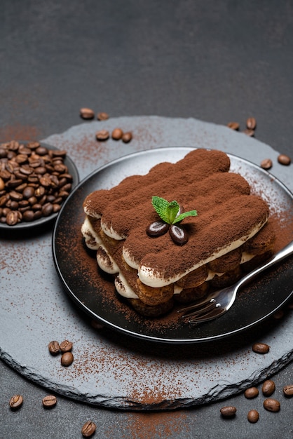 Classic tiramisu dessert on a ceramic plate