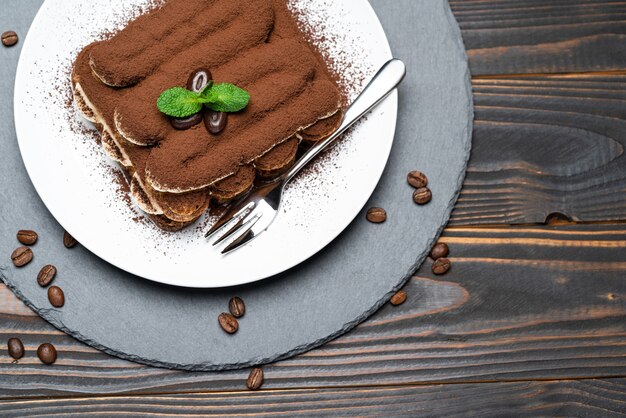 Classic tiramisu dessert on a ceramic plate