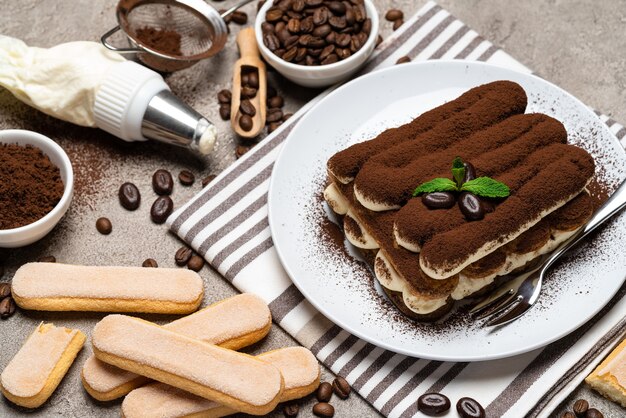 Classic tiramisu dessert on a ceramic plate