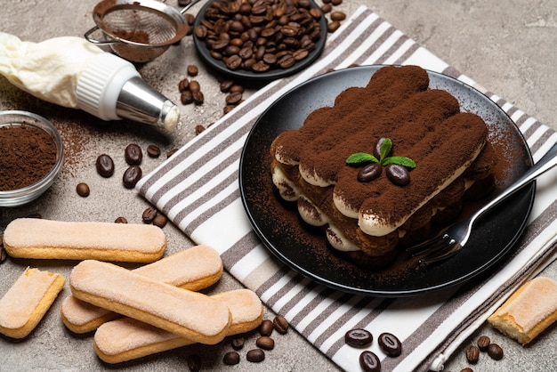 Classic tiramisu dessert on a ceramic plate