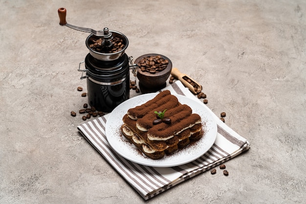 Classic tiramisu dessert on a ceramic plate