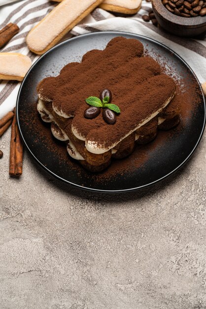 Classic tiramisu dessert on a ceramic plate