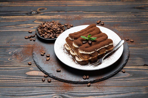 Classic tiramisu dessert on a ceramic plate