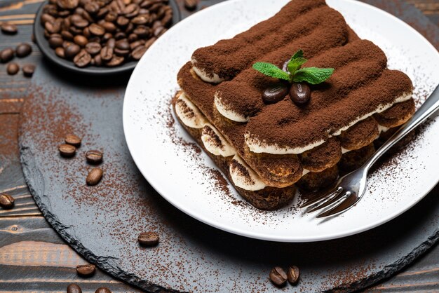 Classic tiramisu dessert on a ceramic plate