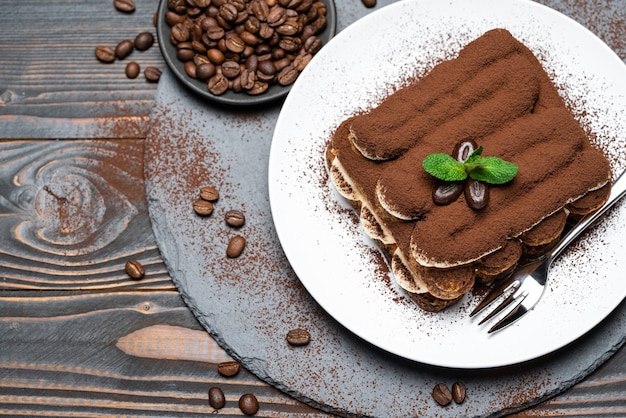 Classic tiramisu dessert on a ceramic plate