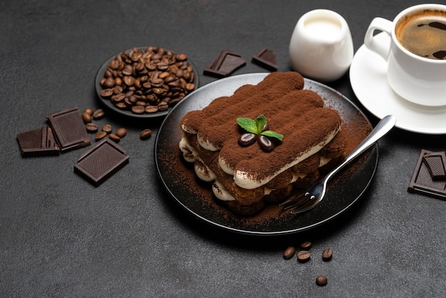 Classic tiramisu dessert on concrete background