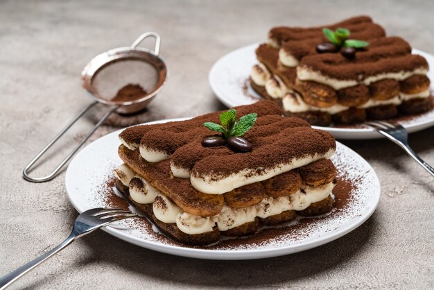 Classic tiramisu dessert on concrete background