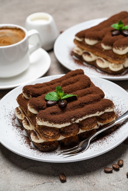 Classic tiramisu dessert and a cup of coffee