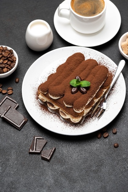 Classic tiramisu dessert and a cup of coffee