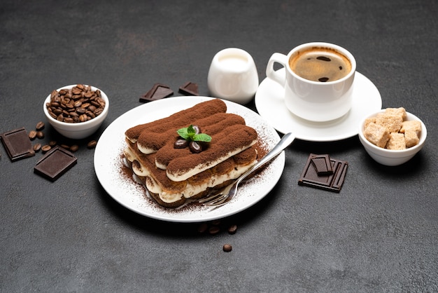 Classic tiramisu dessert and a cup of coffee