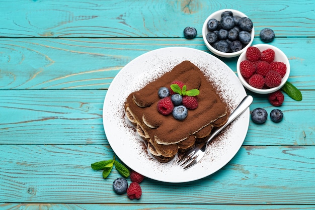 Classic tiramisu dessert with berries