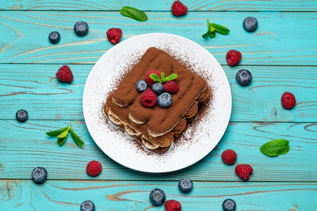 Classic tiramisu dessert with berries