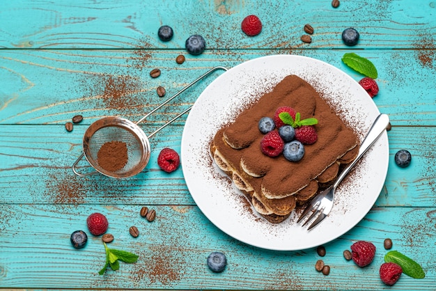Classic tiramisu dessert with berries