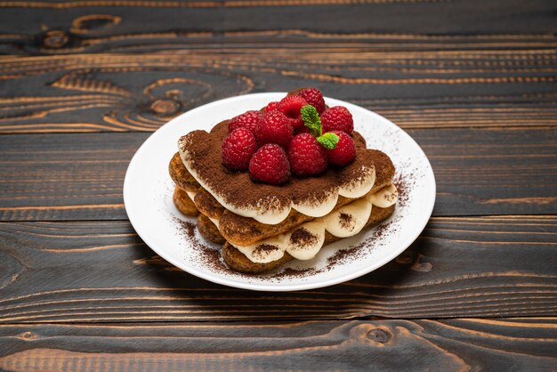 Classic tiramisu dessert with raspberries