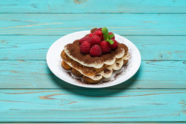 Classic tiramisu dessert with raspberries