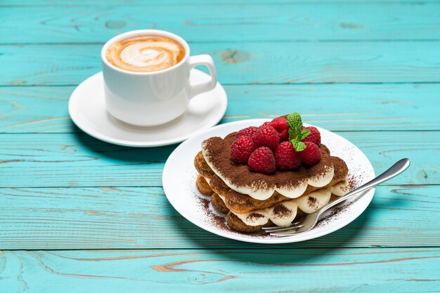 Classic tiramisu dessert with raspberries