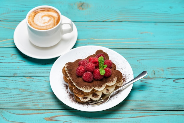 Classic tiramisu dessert with raspberries