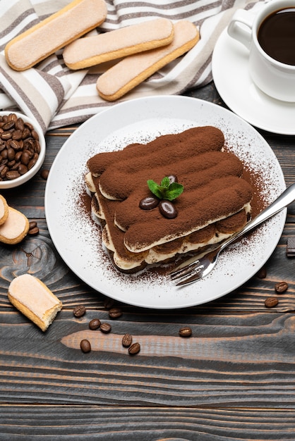 Classic tiramisu dessert on wooden background