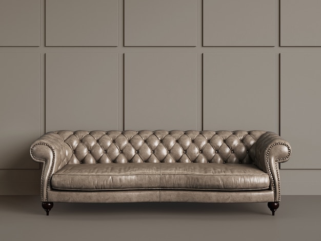 Classic tufted sofa  in empty room with beige walls.Minimal concept