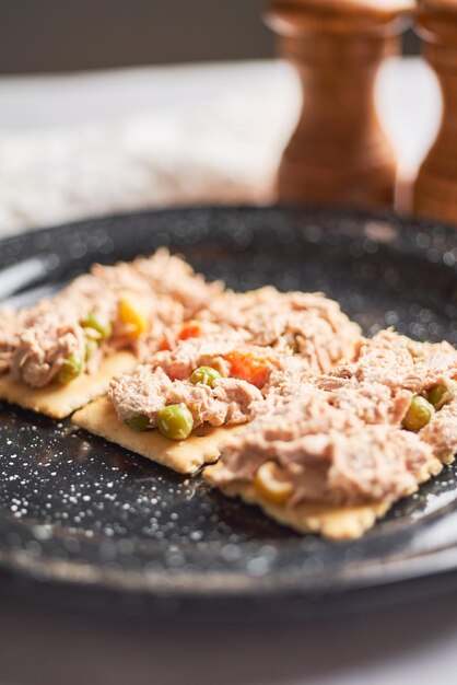 Classic tuna salad with soda crackers and mayonnaise