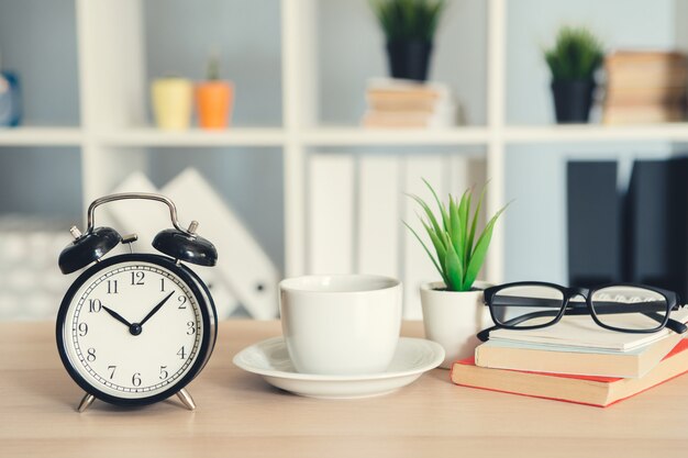 Classic vintage  alarm clock and  coffee cup