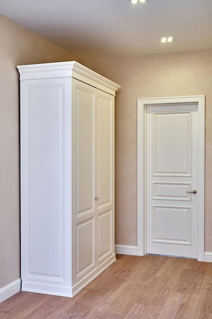 Photo classic wardrobe and interior door in beige interior classic furniture furniture manufacture