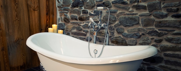 Classic white bathtub with stainless steel