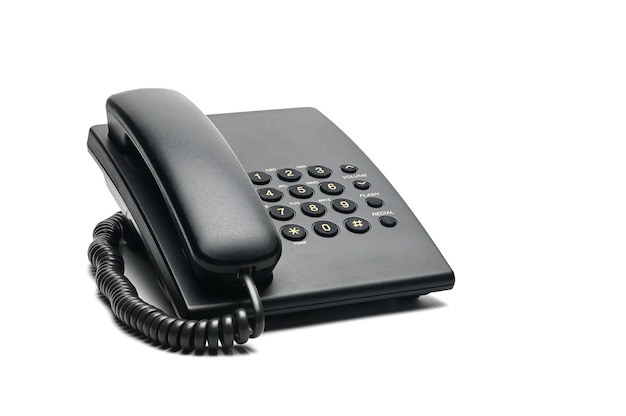 Classic wired telephone used at home and in offices on a white.