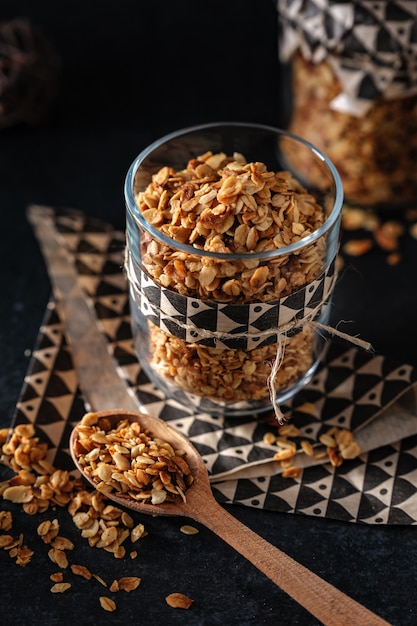 Classical granola in a glass on dark