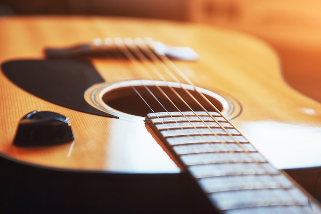 classical guitar on a light brown background