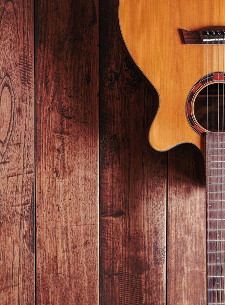 Photo classical guitar on wooden background