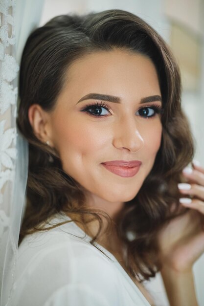 Classical young gourgeous bride. Studio interior fashion shot of fashion model in wedding dress