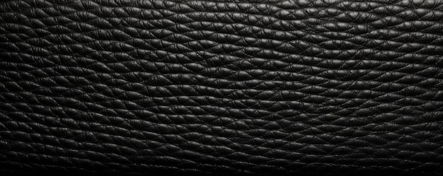 Стильная текстура черной кожи с тонкими зернистыми узорами, источающими элегантность и изысканность.