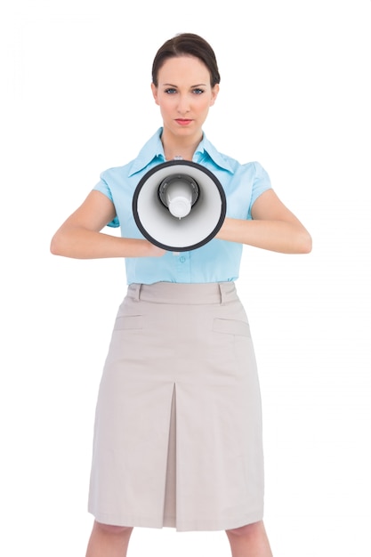 Classy businesswoman holding megaphone