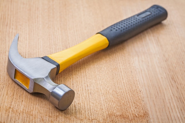 Claw hammer on wooden board