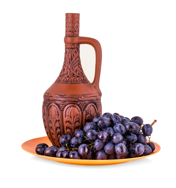 Clay bottle and grapes