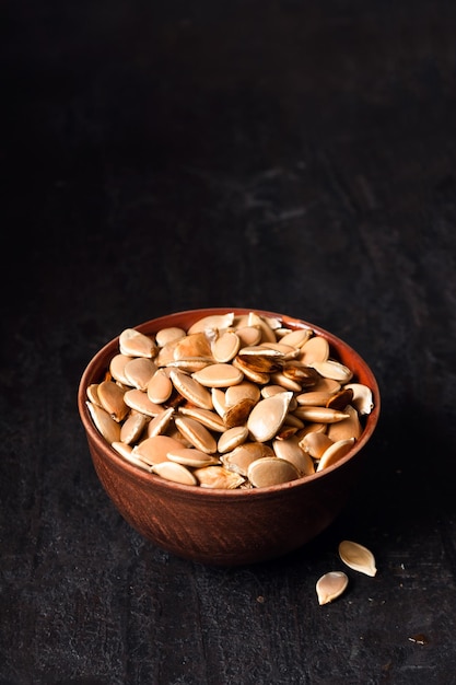 Clay bowl with pumpkin seeds