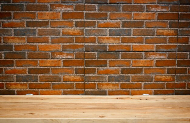 Clay brick texture of wall with wooden board panel on top table.Pattern texture for background.