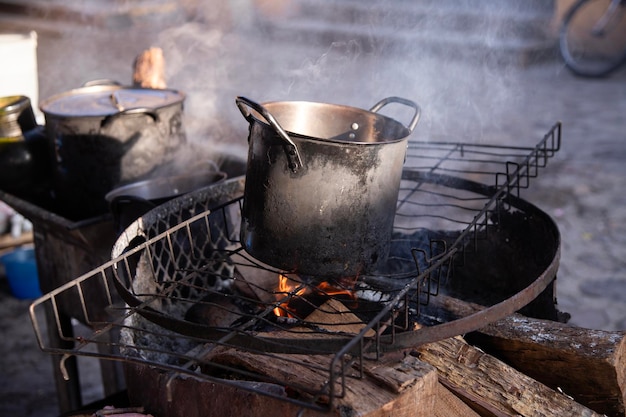 clay and iron pots at a street food stand in oaxaca cooking traditional mexican cafe de olla