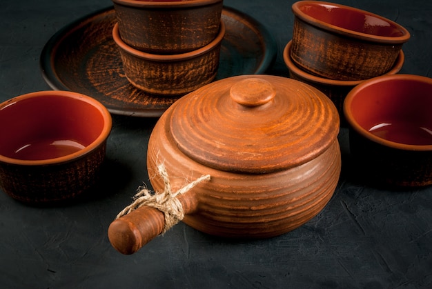 Clay rustic dishes on a stone  table