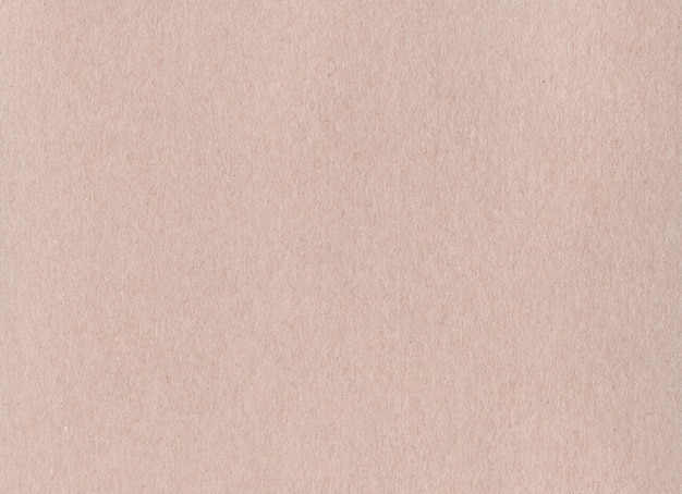 Clean brown kraft cardboard paper background texture. Vintage cardboard wallpaper