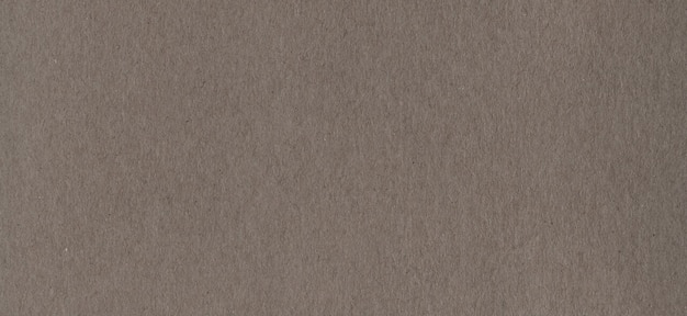 Clean brown kraft cardboard paper background texture. Vintage cardboard