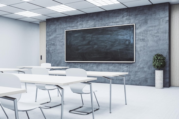 Clean classroom with empty black chalkboard