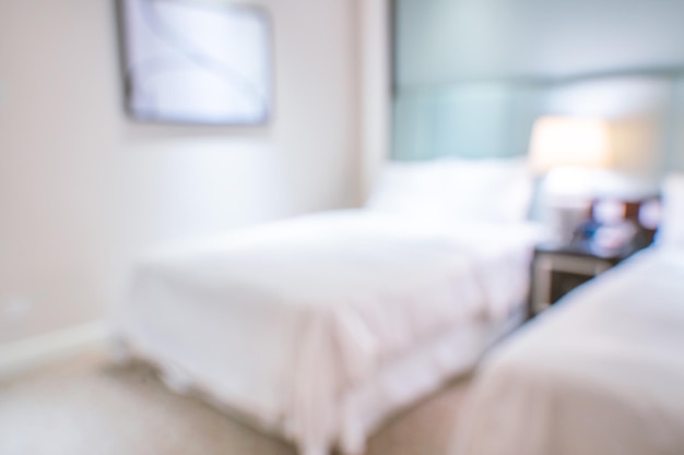 Чистый и уютный современный интерьер спальни отеля с двуспальной кроватью абстрактное расфокусированное размытие с фоном боке концепция дизайна роскошной поездки