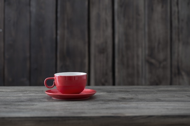 Clean cup on old wooden background